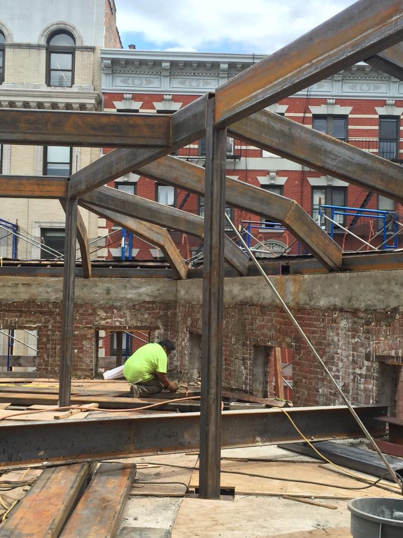 Worker installing structural steel in NYC