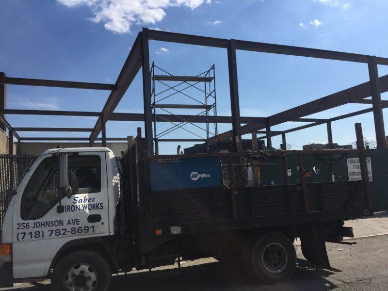 Saber Iron Works truck on job site